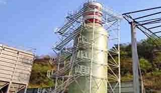 FRP access platforms, structural profiles, and safety barriers installed along the external framework of a chemical distillation tower.