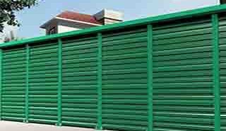 FRP noise reduction barrier panels and structural vertical support posts installed for utility infrastructure screening and environmental noise control.