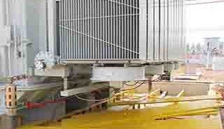 FRP grating panels and cable trench covers installed over outdoor power transformer substation basins.