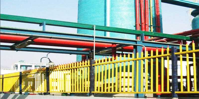 FRP yellow guardrails and structural profiles installed in a power generation and utility facility, illustrating corrosion-resistant material selection for industrial infrastructure.